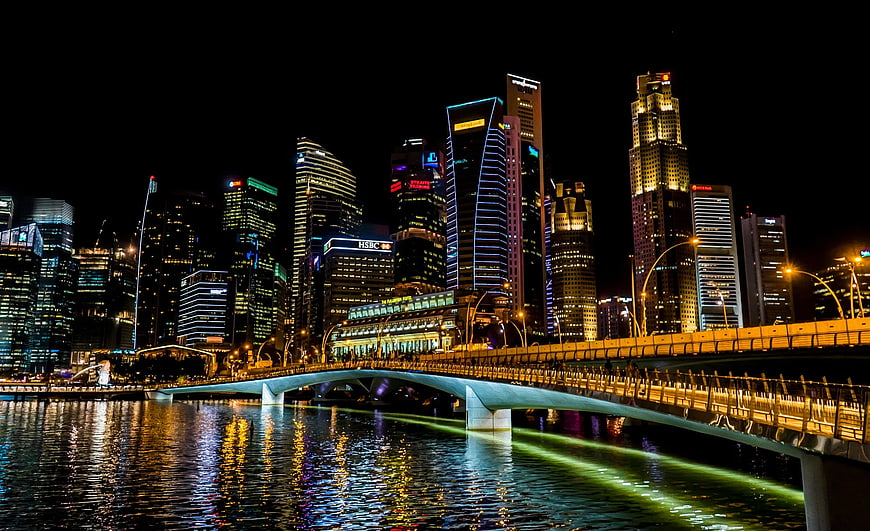 Singapore skyline at night with Helix Bridge and Marina Bay