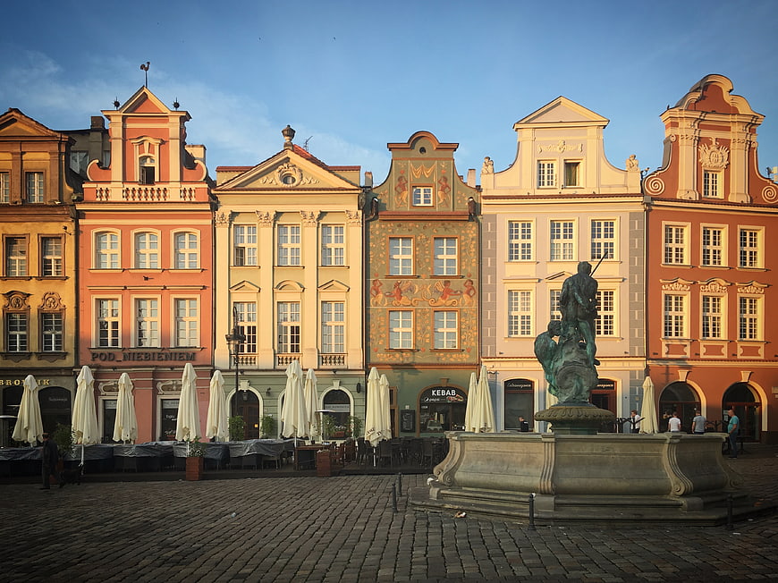 Colorful Historic Town Hall Buildings and Statue in European Square