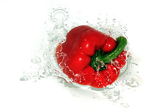 Fresh Red Bell Pepper Splashing in Water