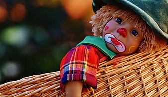 Sad Clown Doll in Wicker Basket