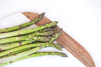 Fresh Green Asparagus on Wooden Cutting Board