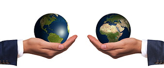 Two business hands holding globes of Americas and Africa