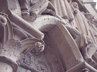 Close-up of Gothic stone carvings and statues on a cathedral facade