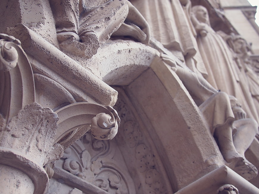 Close-up of Gothic stone carvings and statues on a cathedral facade