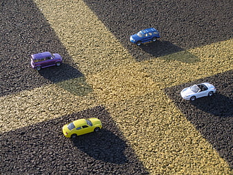 Top View of Colorful Toy Cars on Asphalt Parking Lot