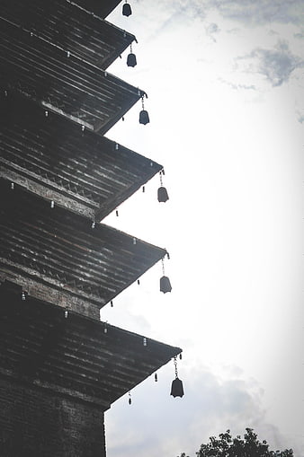 Low angle view of ancient pagoda eaves with hanging bells