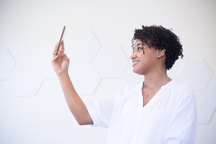 Happy African American Woman Taking Selfie with Smartphone