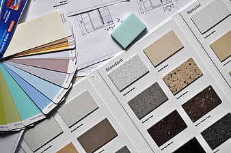 Interior design materials, color swatches, and architectural blueprints
