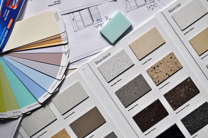 Interior design materials, color swatches, and architectural blueprints