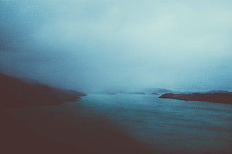 Misty Blue Fjord Landscape with Foggy Islands
