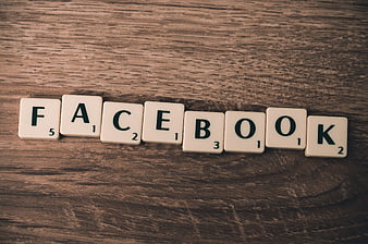 Facebook spelled with Scrabble tiles on wood