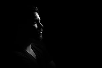 Dramatic Black and White Profile of Man in Shadows