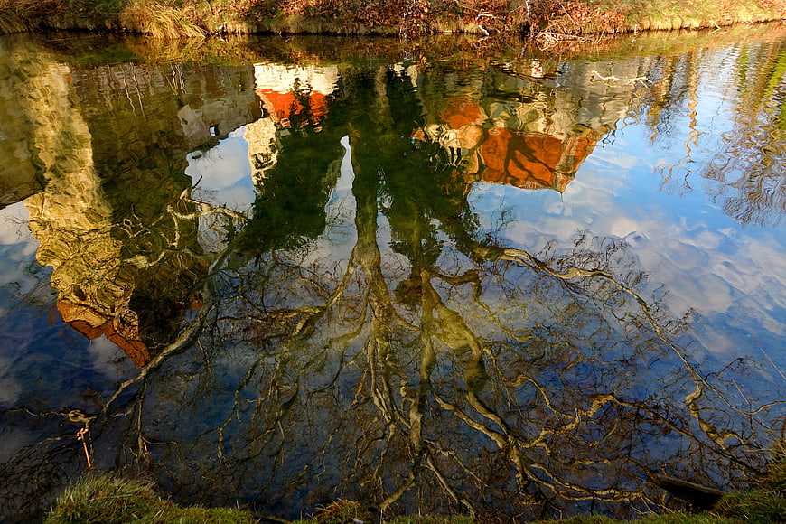 Autumn Tree and Ruin Reflection in Pond Water
