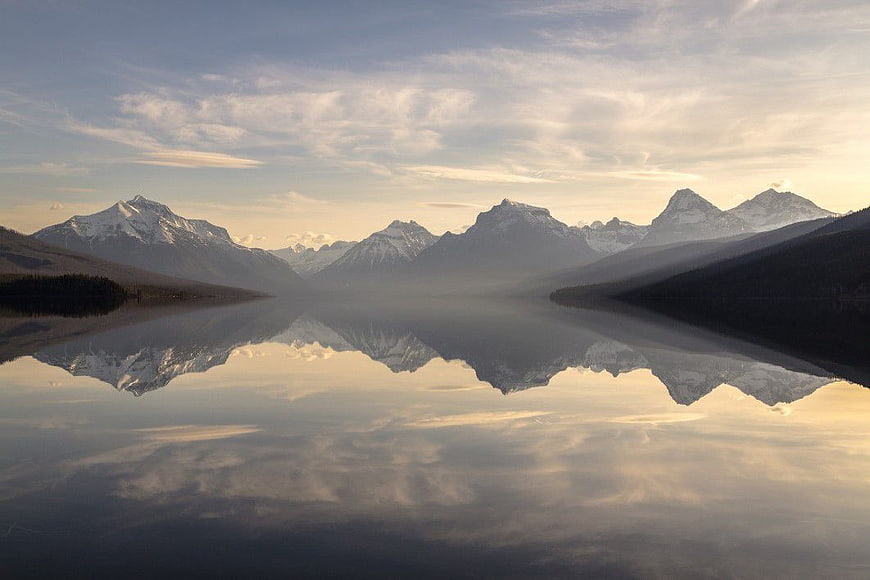 Serene Mountain Lake Reflection at Sunrise