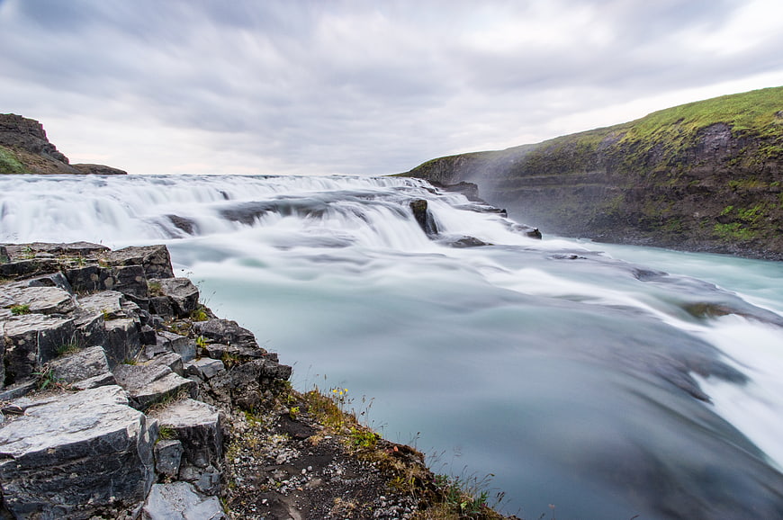 Long Exposure Waterfall Flowing Over Rocky Cliffs
