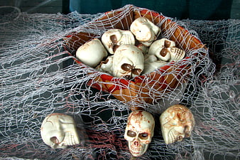 Halloween Skulls in Net Basket