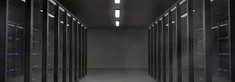 Dark server room with rows of racks and blue LED lights