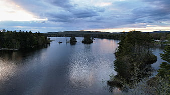 Serene Lake Landscape with Forested Islands at Dusk