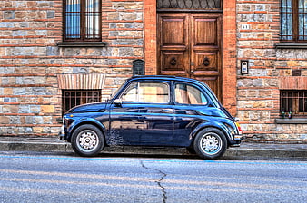 Classic Blue Fiat 500 Parked on Cobblestone Street