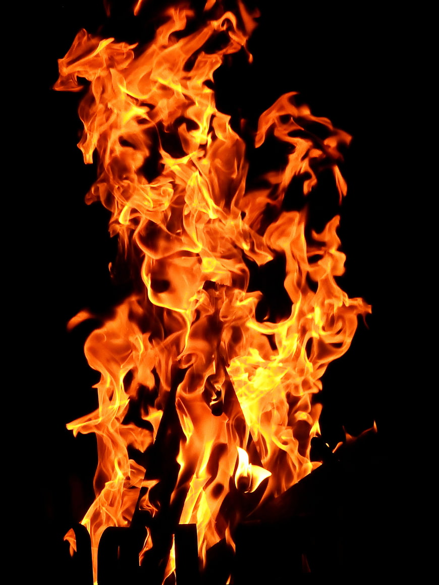 Vibrant Orange Flames Burning Against Black Background