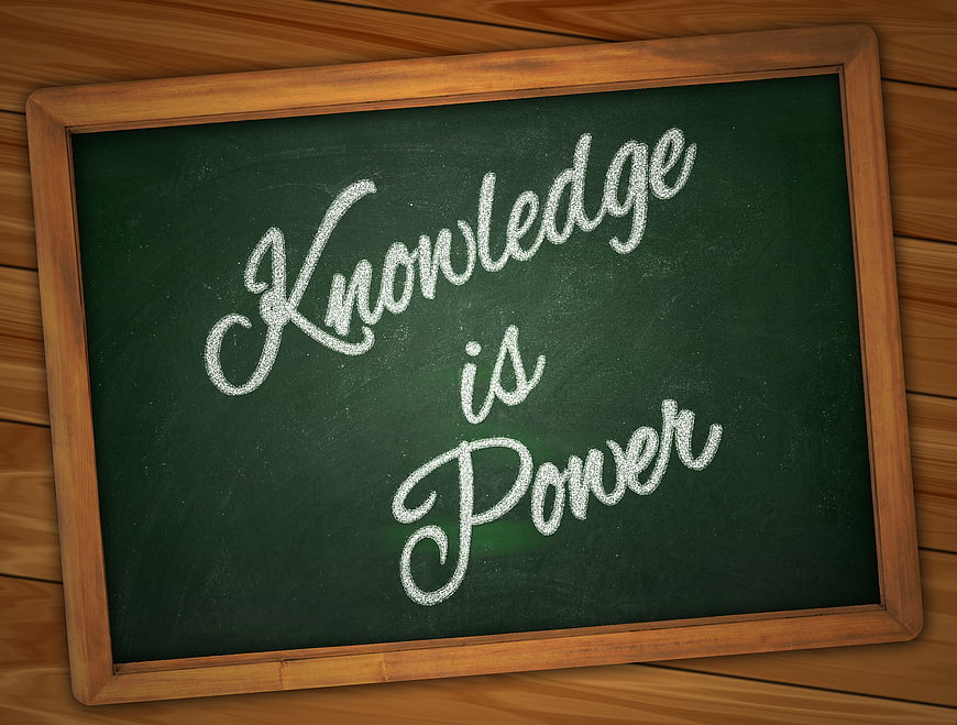 Knowledge is Power Chalkboard Quote on Wooden Background