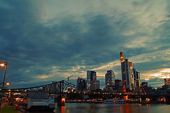 Frankfurt Skyline at Dusk with Iron Bridge and River