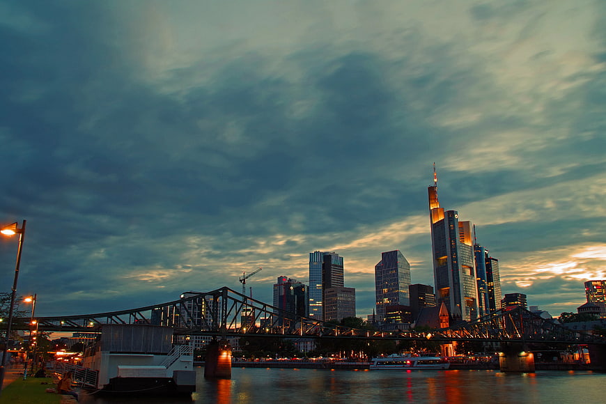 Frankfurt Skyline at Dusk with Iron Bridge and River