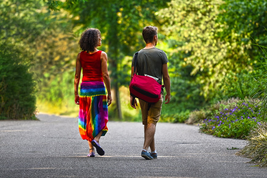 Couple Walking Away on Country Road in Summer