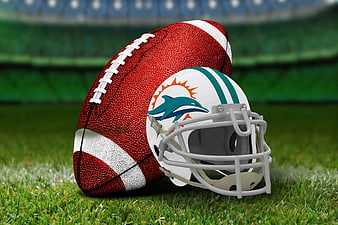 Miami Dolphins Helmet And Football On Green Grass