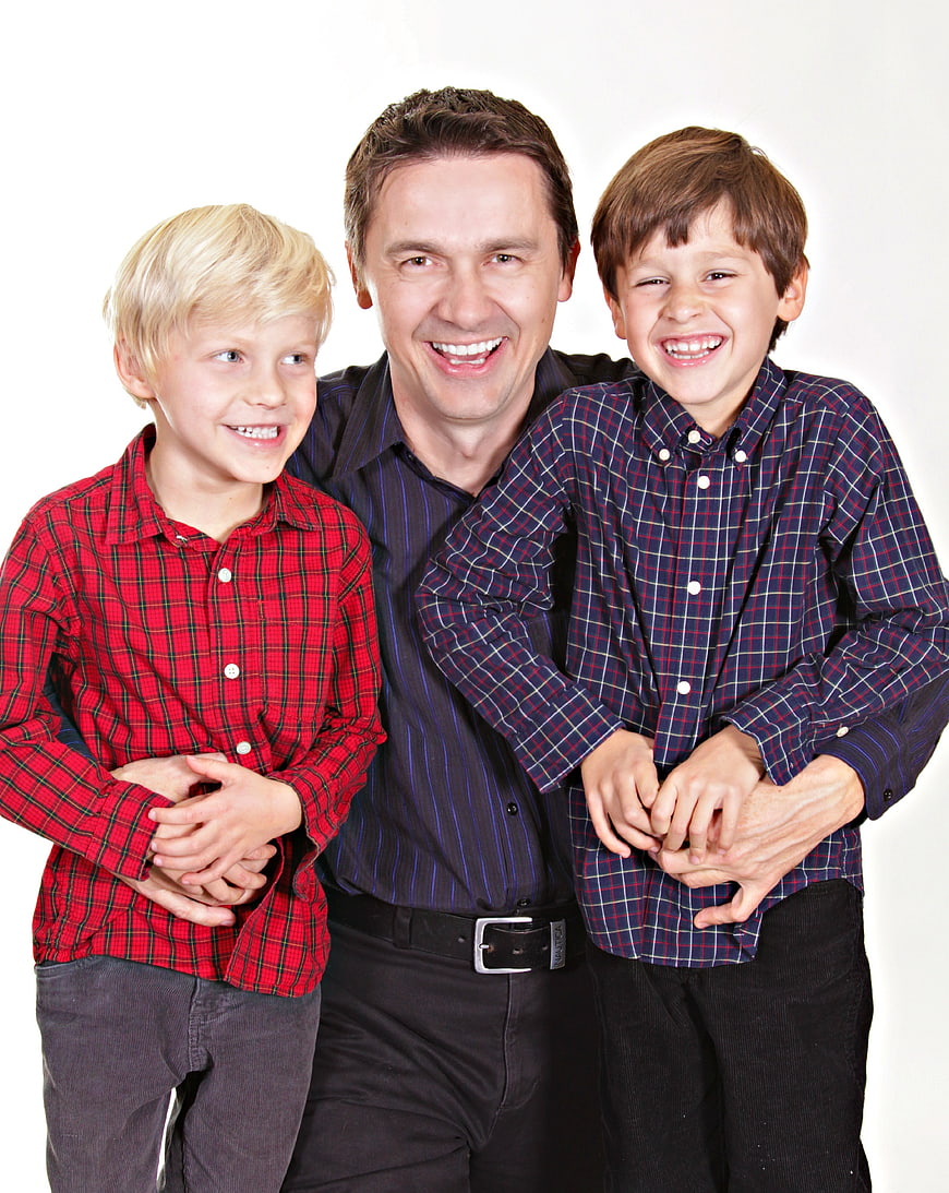 Happy Father And Two Sons Family Portrait On White Background