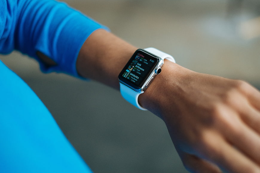 Close-up of smartwatch on wrist with fitness app