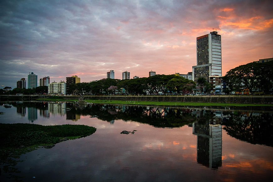 City Skyline Reflection in River at Sunset