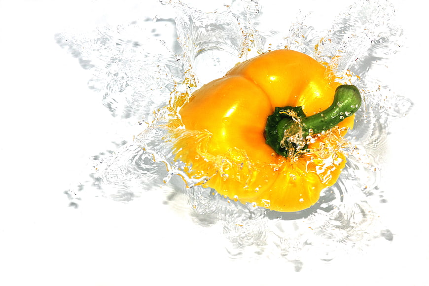 Fresh Yellow Bell Pepper Splashing in Water