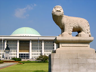 Stone Guardian Lion Statue In Front Of National Assembly Building In Seoul