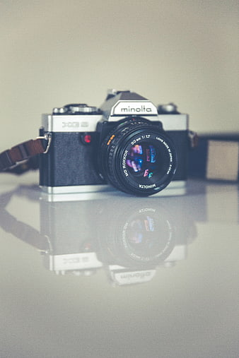 Vintage Minolta XG-3 Film Camera with Reflection