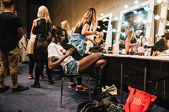 Backstage Fashion Week Makeup Room with Models