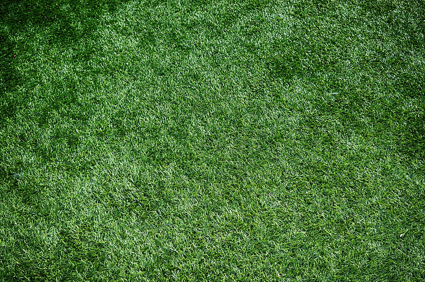 Close-up texture of green artificial turf grass background