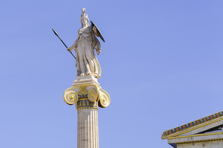 Statue of Athena on Ionic Column Against Blue Sky