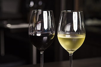 Red and White Wine Glasses on Dark Background