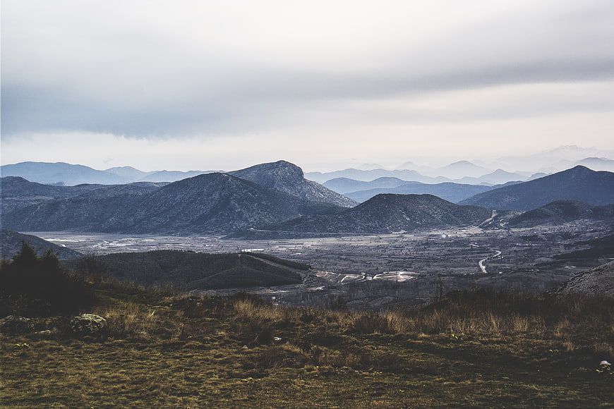Panoramic mountain landscape with valley and overcast sky