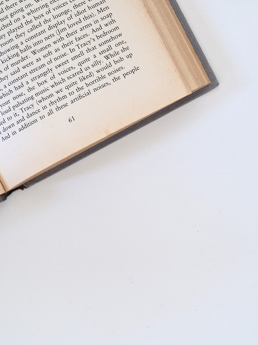 Open Vintage Book Page on White Background with Copyspace