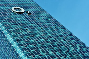 Low angle view of O2 Tower glass facade Munich