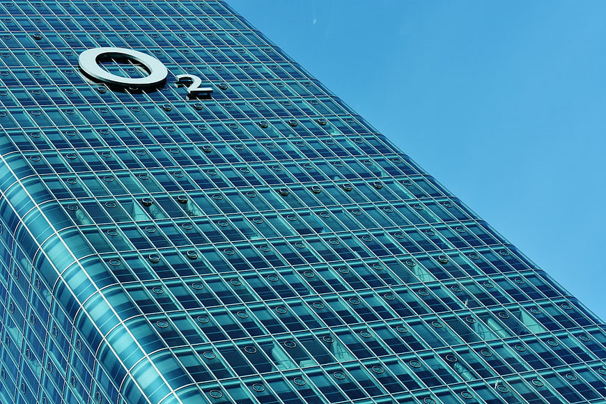 Low angle view of O2 Tower glass facade Munich