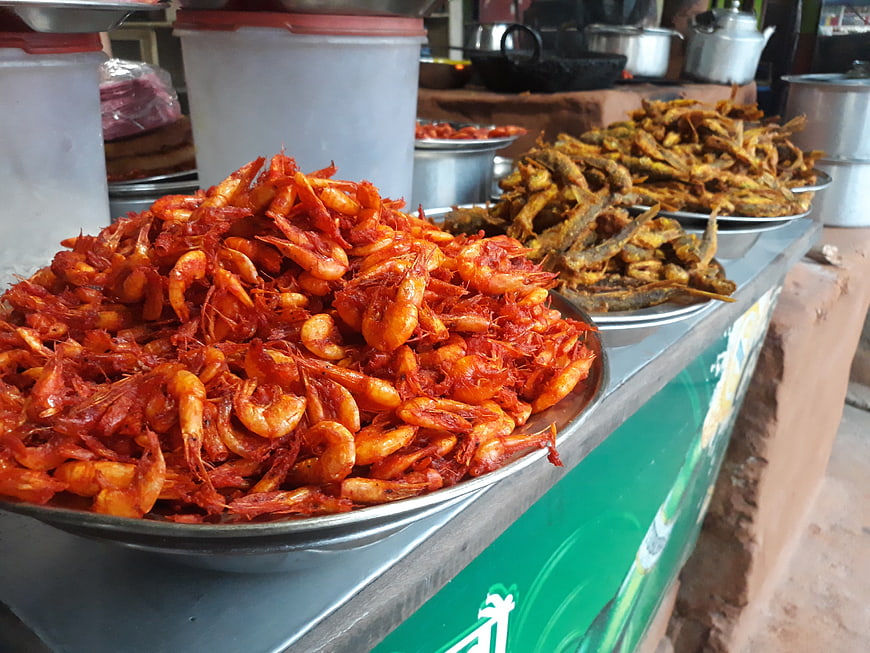 Spicy fried shrimp and fish at a Nepalese street food stall