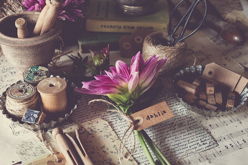 Vintage Dahlia Flower with Rustic Craft Supplies on Sheet Music
