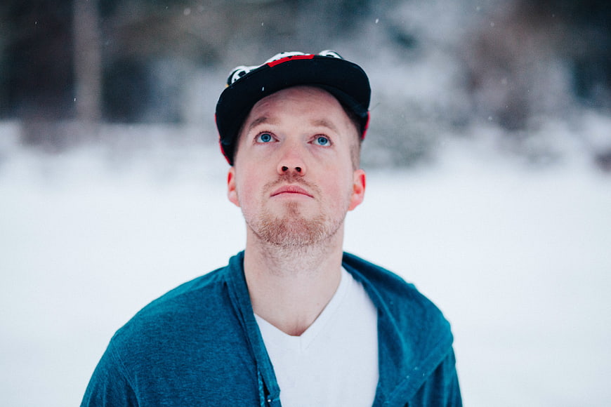 Portrait of Man in Winter Snow with Cap