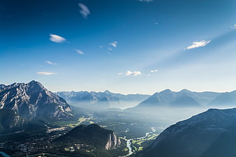 Majestic Mountain Valley Landscape with River and Blue Sky
