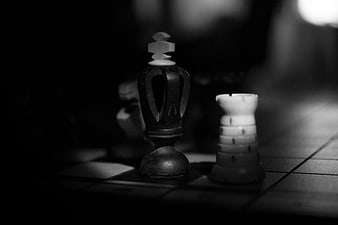 Dramatic Black and White Chess Pieces on Board