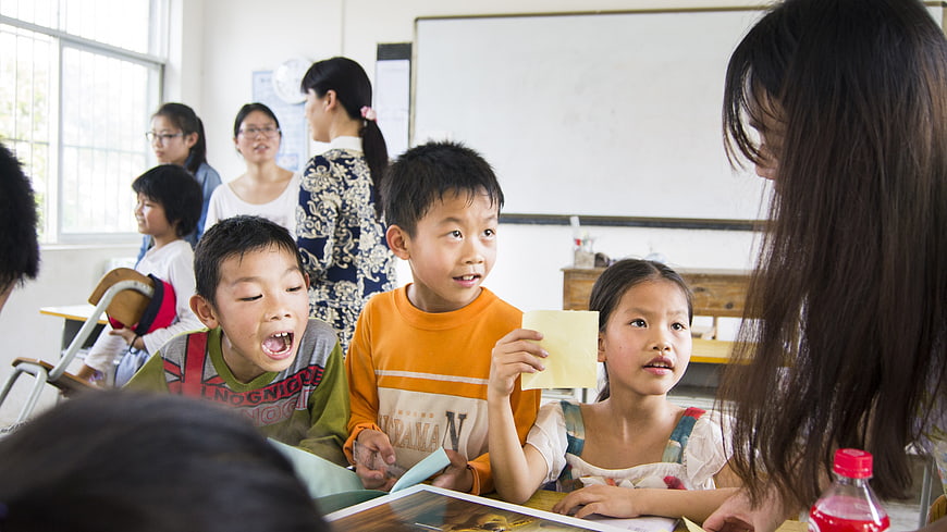 Elementary School Children Participating In Classroom Learning Activity