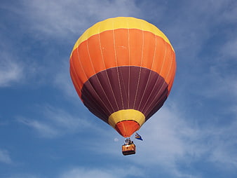 Colorful Hot Air Balloon Flying in Blue Sky